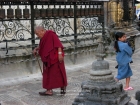 Nepal, Central Region, Bagmati Zone, Kathmandu, Swayambhou: An old monk circling round the great stupa