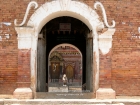 Nepal, Central Region, Bagmati Zone, Bhaktapur District: Changu Narayan Temple; The gate to the Changu Narayan temple. In the back the Narayan-Temple, dedicated to Vishnu, guarded by Garudas