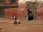 Nepal, Central Region, Bagmati Zone, Patan, Durbar Square: Porter in front of the museum