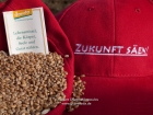 Germany, Stuttgart-Moehringen: Farmers and friends of the biolocical working Reyerhof having a religious ceremony for sowing the old traditional winter- wheat kind 'Viva' on their field. App. 500 corns per sqm, 100 kg per hectar is needed