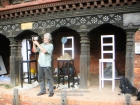 Nepal, Central Region, Bagmati Zone, Lalitpur, Patan, Sutra International Workshop at Patan Durbar Mul Chowk: Andreas Schoenfeldt from Southafrica filming the partipiciants while their preparations of the installations