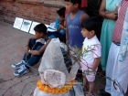 Nepal, Central Region, Bagmati Zone, Lalitpur, Patan, Durbar Square: Spectators watching the theaatre play of Alex Gargili' theatregroup at my object "Prisoned Peace" at the Open Day of Sutra International Workshop