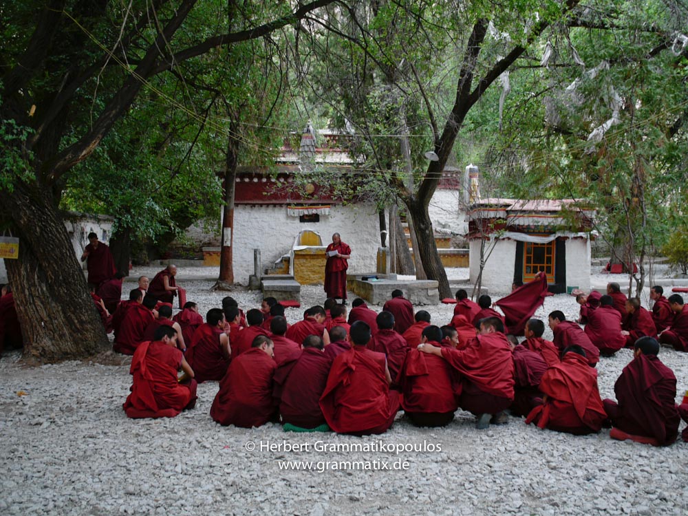 Tibet, Lhasa, Sera Monastery: Monk at their public ritual "violent" afternoon discussion at the Depating Courtyard