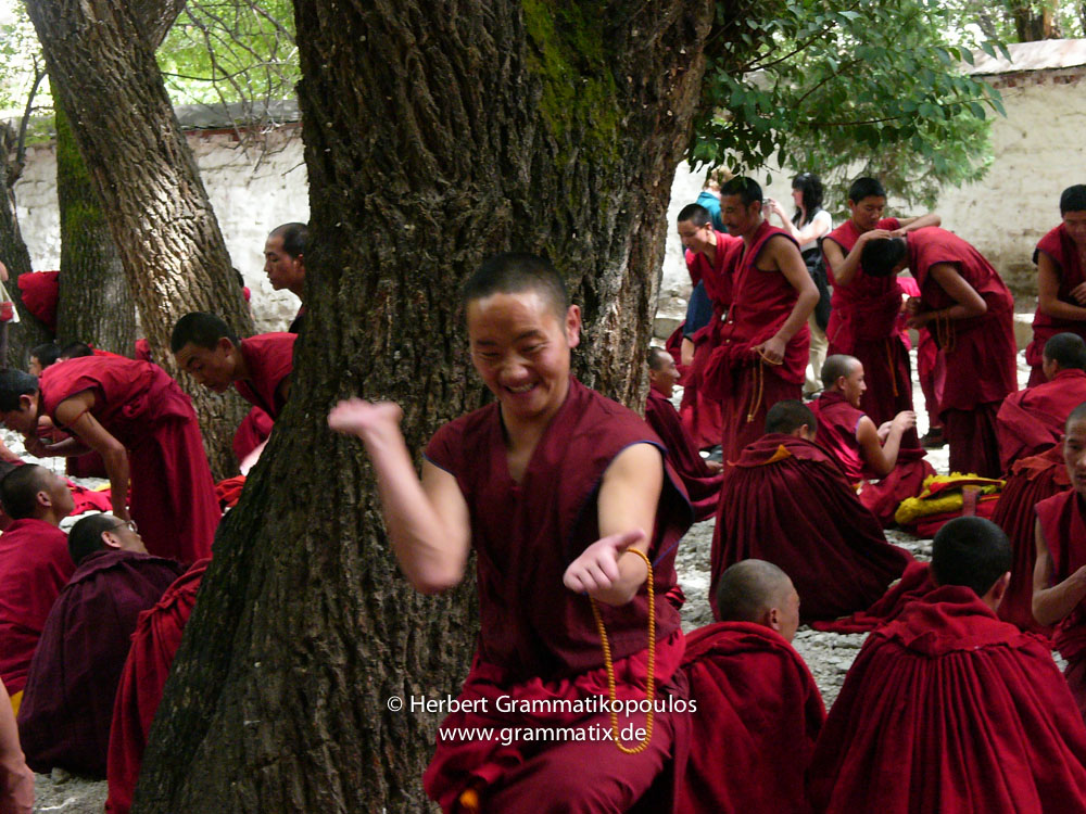 Tibet, Lhasa, Sera Monastery: Monk at their public ritual "violent" afternoon discussion at the Depating Courtyard