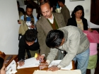 Nepal, Kathmandu, Kamaladi, Gallery 32, inauguration of the exhibition "Bells - Silence and Sounds": Visitors of the inauguration ceremony writing into the guestbook