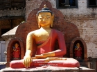 Nepal, Central Region, Bagmati Zone, Kathmandu, Swayambhunath: Yellow Buddha at the Shantipura Buildings at the north of the compound