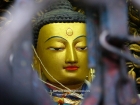 Nepal, Central Region, Bagmati Zone, Kathmandu, Swayambhunath: Golden face of Buddha in a niche of the great stupa