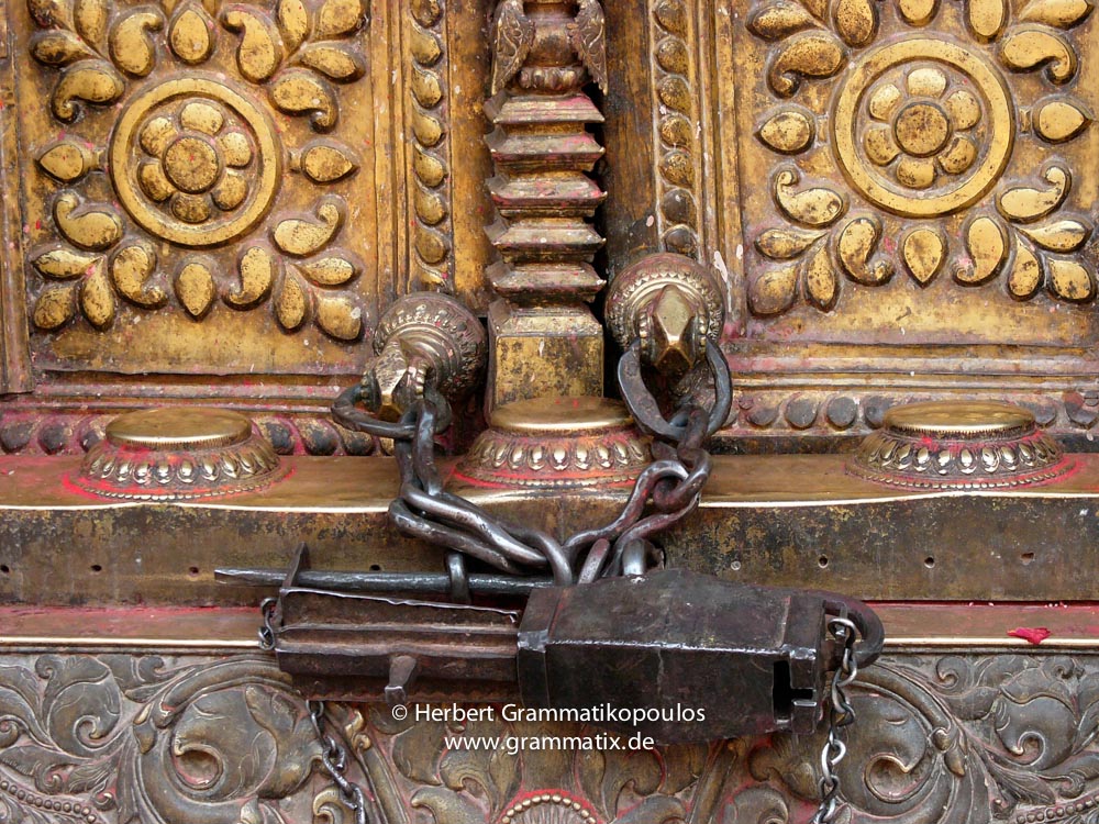 Nepal, Central Region, Bagmati Zone, Bhaktapur District: Changu Narayan Temple; Door covered with brass and two Talsa (here the bottom one) at the westside opposite the Vishnu-Garuda temple at the Narayan-Temple, see also photos L1040511 to L1040 517