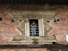 Nepal, Central Region, Bagmati Zone, Kathmandu, Teku: Kid in the window of an old house at the Bagmati river banks